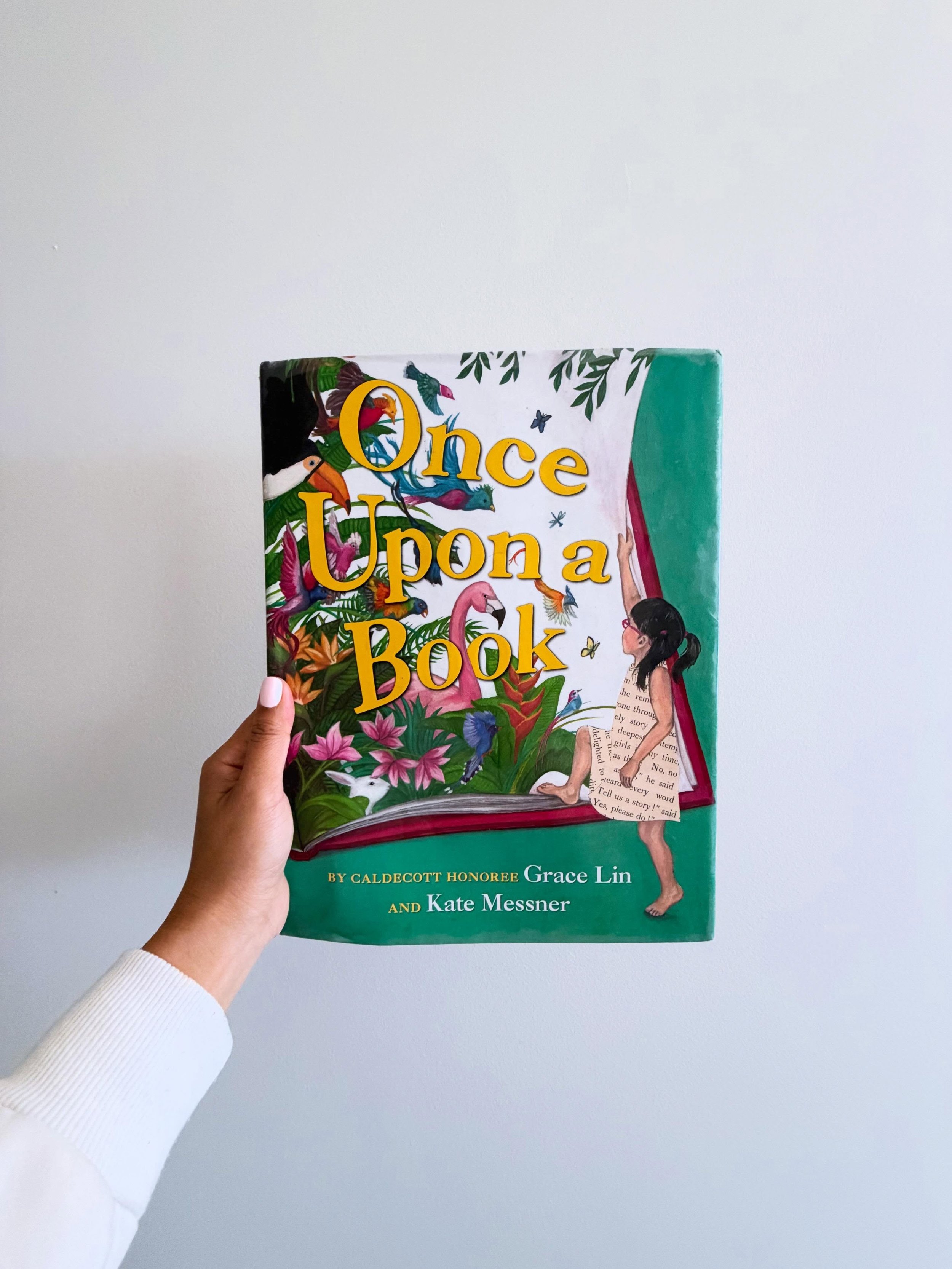 Alice is tired of the cold gray rain and being stuck inside. She stomps through the house, bored and wishing she could be somewhere else. Then a book on the floor flutters its pages open. &ldquo;Once upon a time, there was a girl,&rdquo; it begins. A