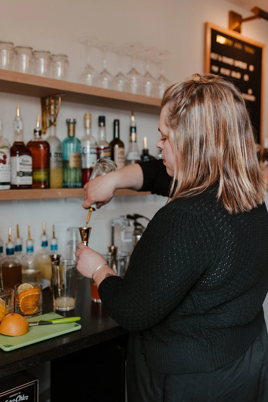 Danelle making cocktails at Heath & Table in Lincoln City, Oregon
