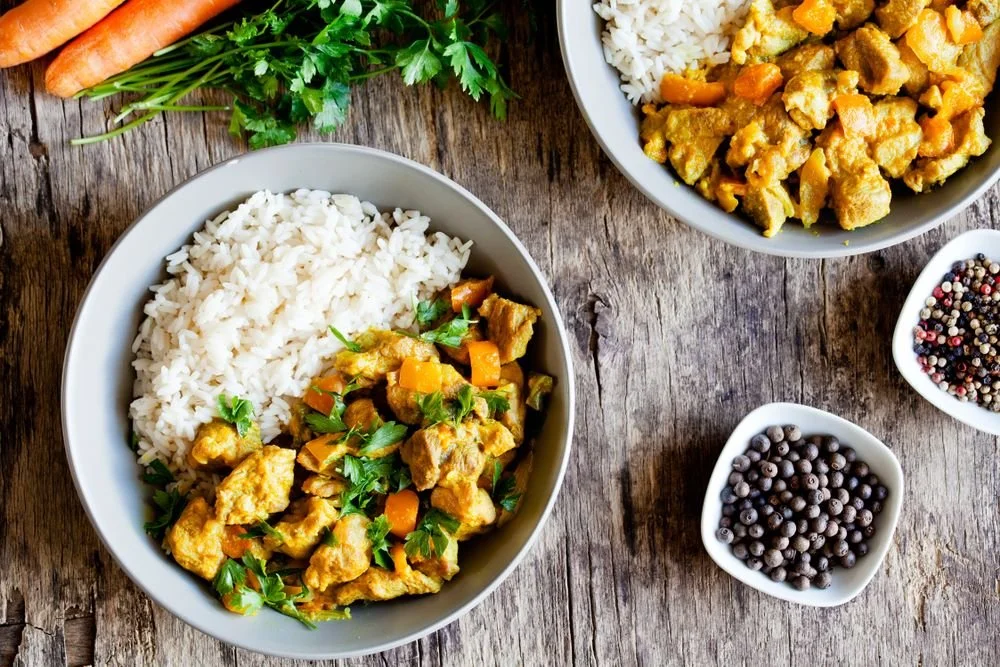 chicken coconut curry bowl with rice and juniper berries