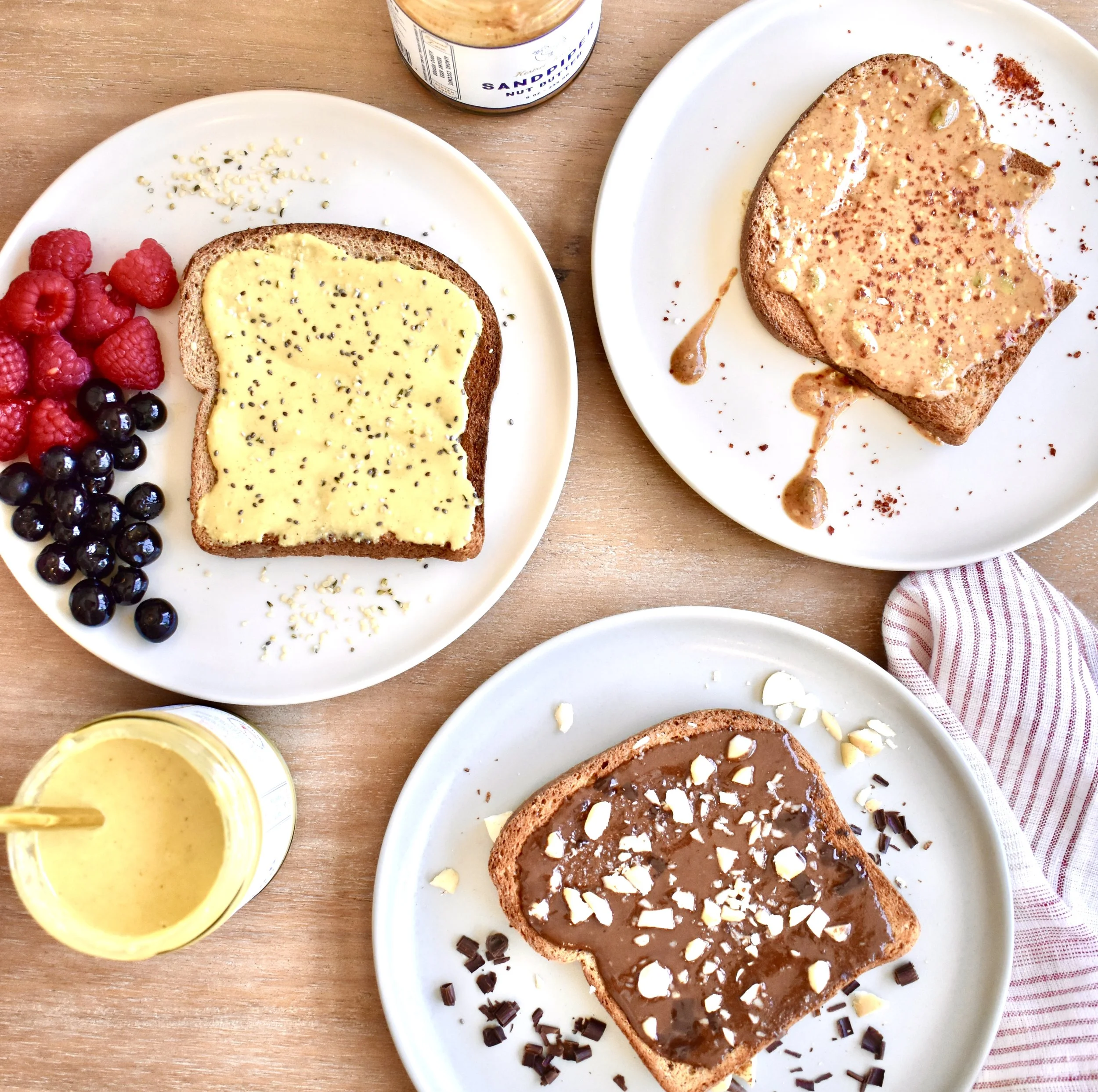 Gourmet nut butter subscription gift styled for food lovers with jars served alongside toast and fruit