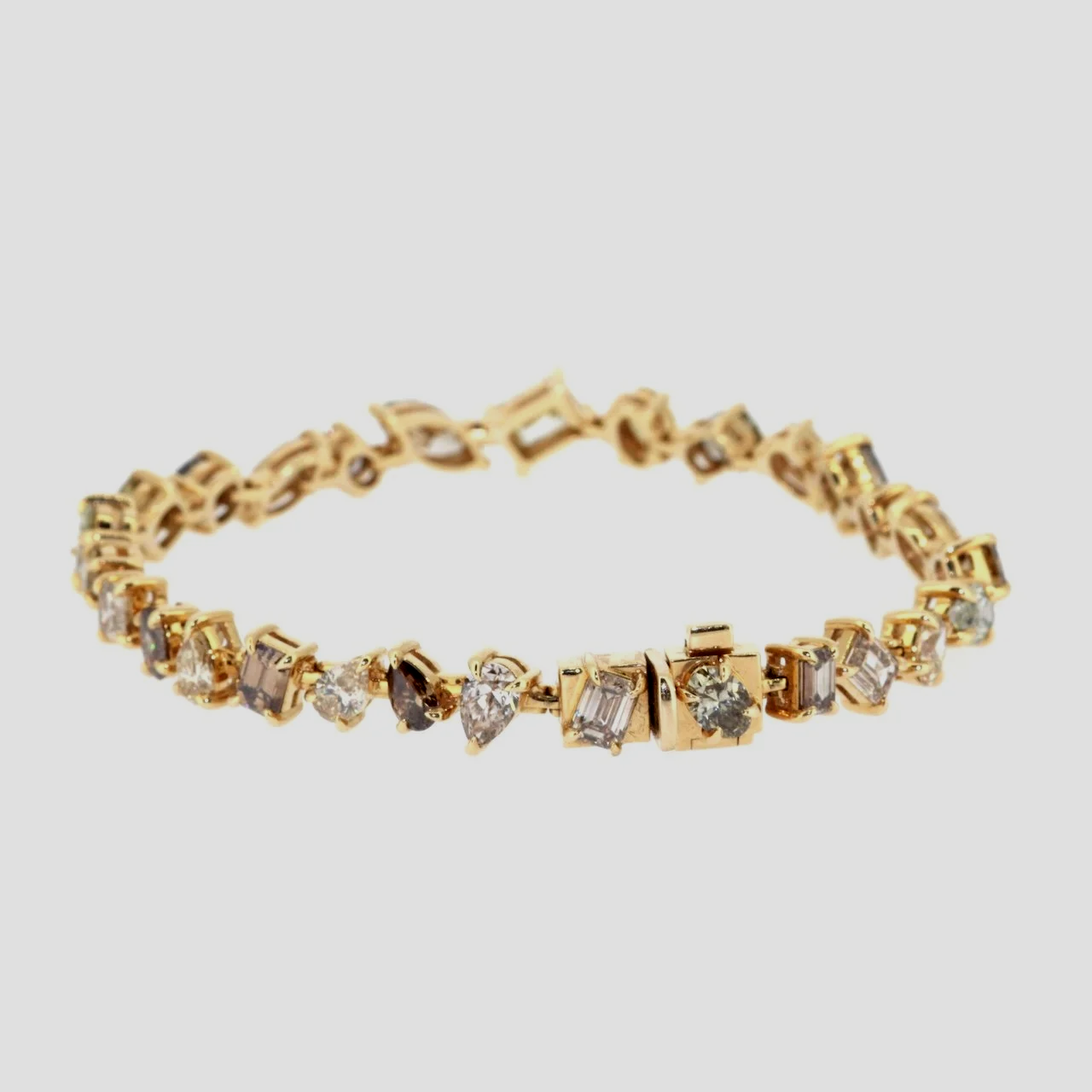 Mixed-shape-cognac-fancy-diamond-bracelet-18k-yellow-gold-jewellery-www.greensteinco.co.uk2.png