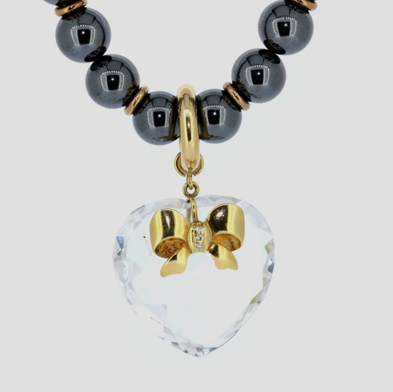 Hematite-rock-crystal-heart-gold-pedant-jewellery-www.saulgreenstein.co.uk1.png