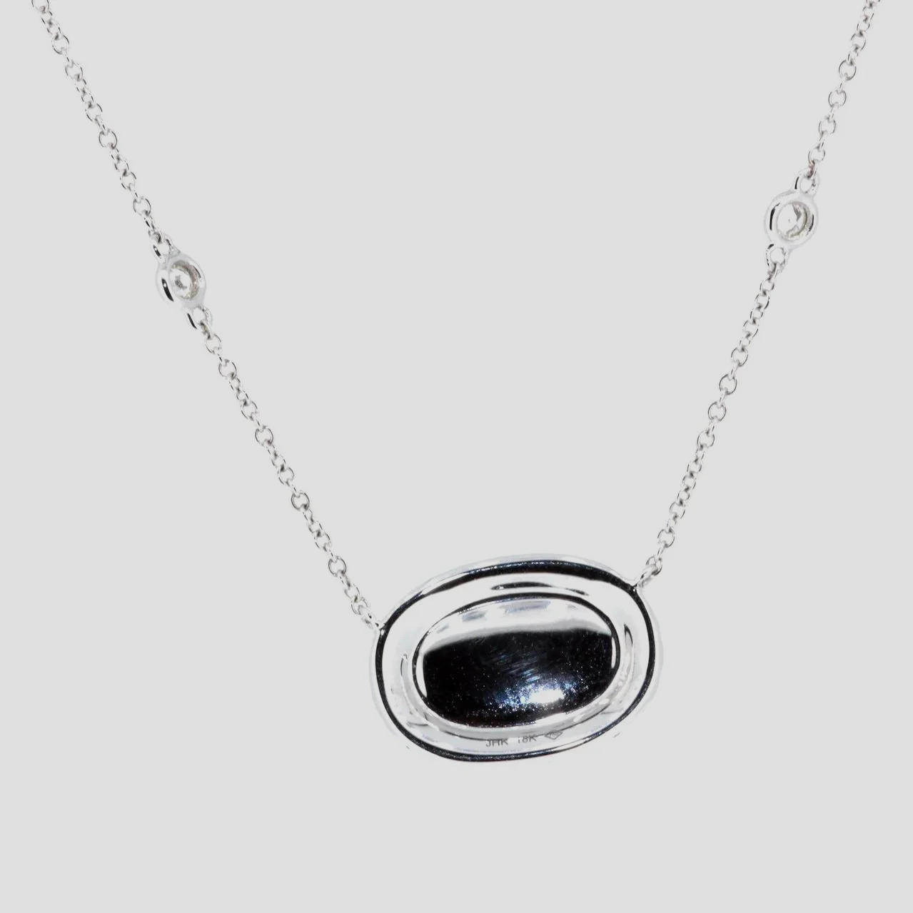 Oval-raw-ruby-diamond-pendant-18k-white-gold-jewellery-www.saulgreenstein.co.uk2.png
