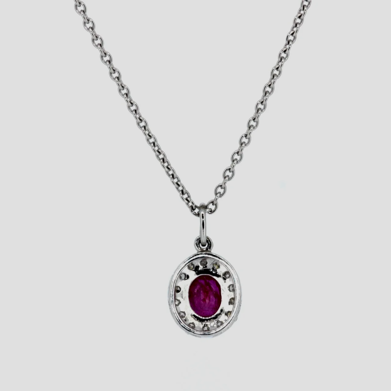 Oval-ruby-diamond-cluster-pendant-jewellery-www.saulgreenstein.co.uk2.png