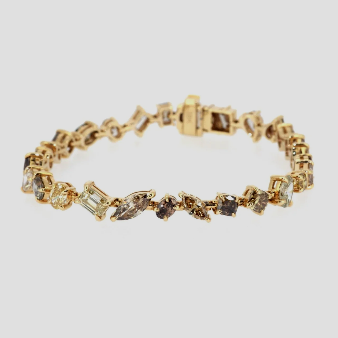Mixed-shape-cognac-fancy-diamond-bracelet-18k-yellow-gold-jewellery-www.greensteinco.co.uk1.png