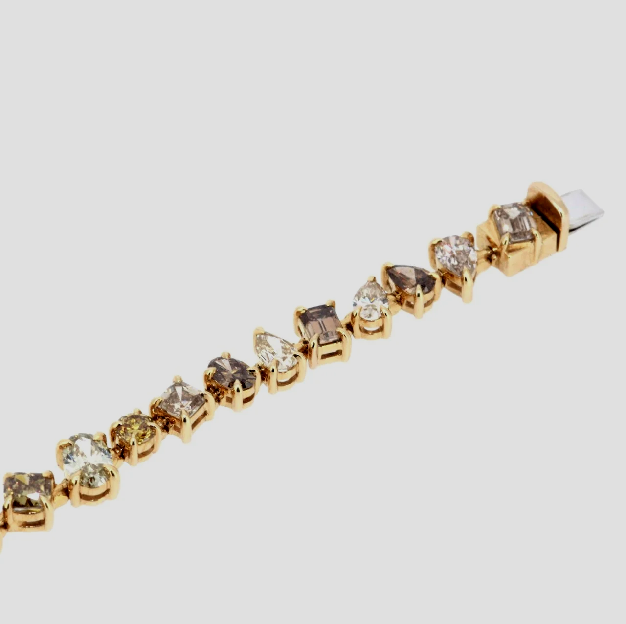 Mixed-shape-cognac-fancy-diamond-bracelet-18k-yellow-gold-jewellery-www.greensteinco.co.uk4.png