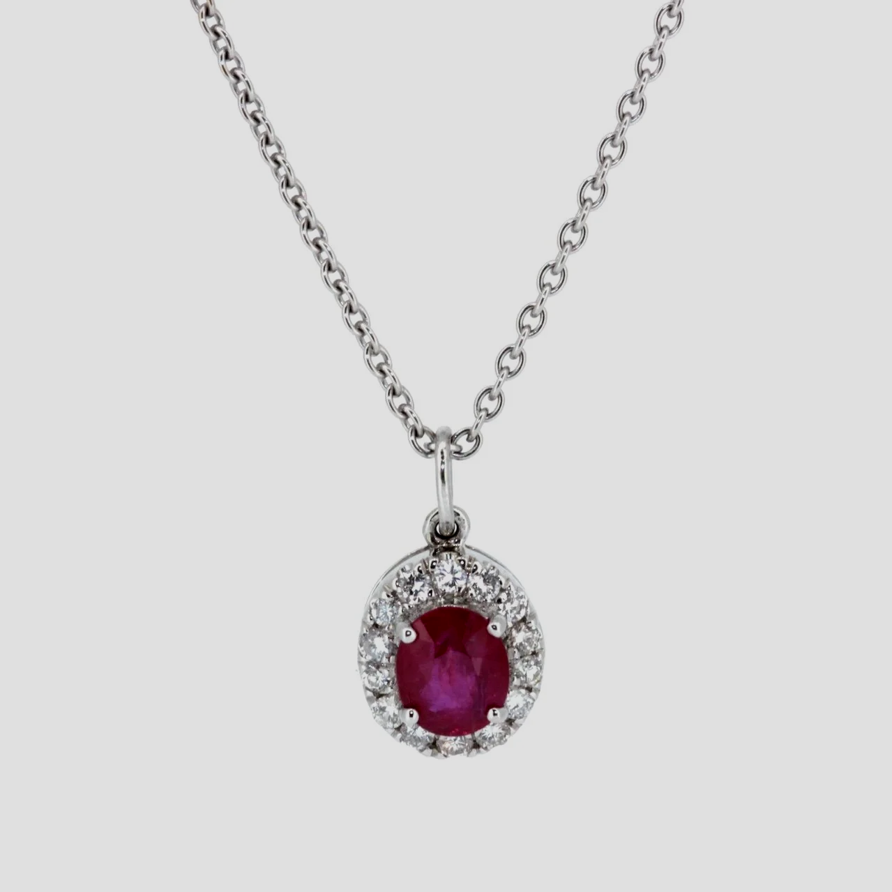 Oval-ruby-diamond-cluster-pendant-jewellery-www.saulgreenstein.co.uk1.png