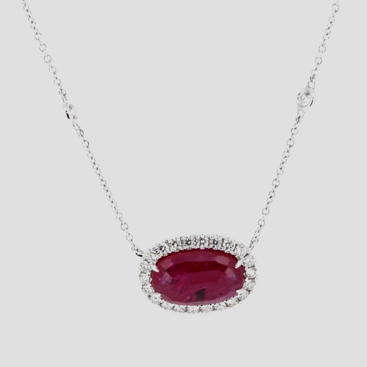 Oval-raw-ruby-diamond-pendant-18k-white-gold-jewellery-www.saulgreenstein.co.uk1.png