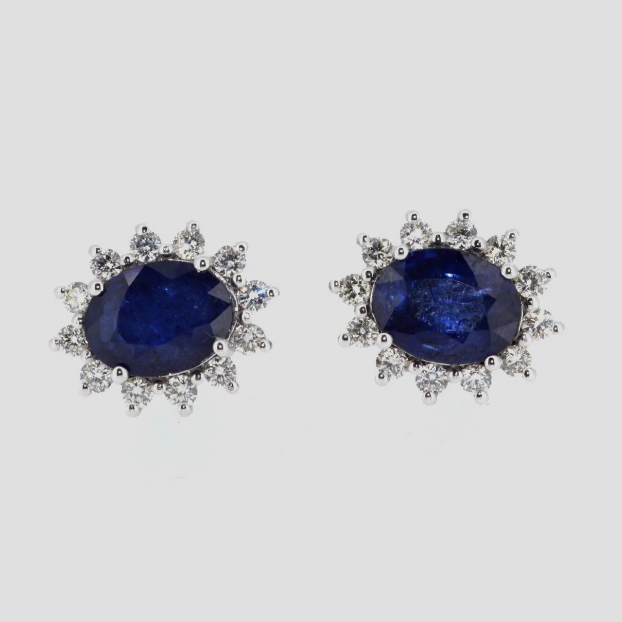Sapphire-diamond-cluster-earrings-18k-white-gold-jewellery-www.saulgreenstein.co.uk1.png