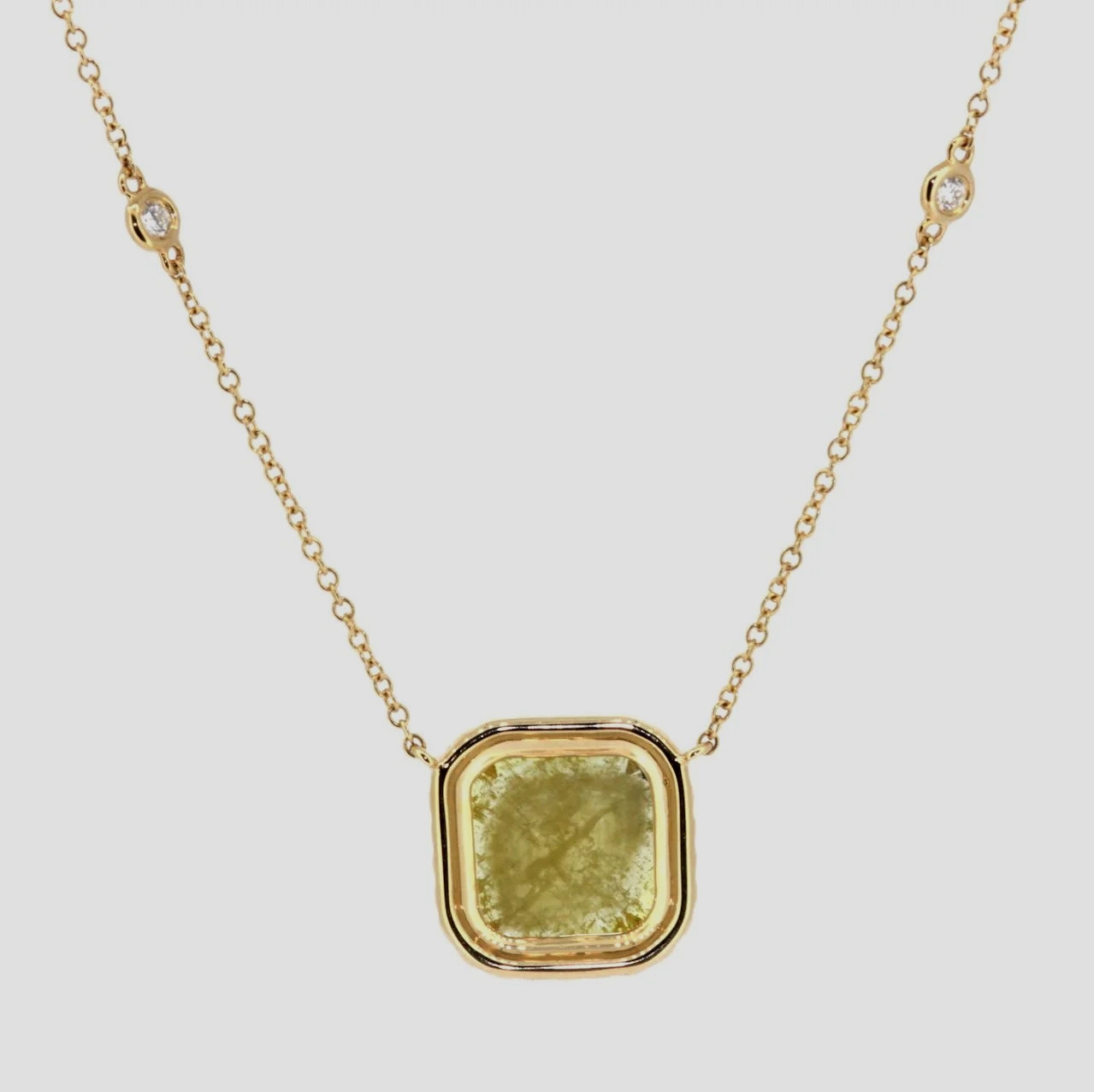 Raw-yellow-diamond-halo-pendant-18k-yellow-gold-jewellery-www.saulgreenstein.co.uk2.png
