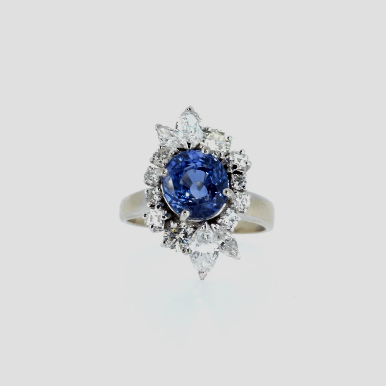 Ceylon-sapphire-diamond-cluster-ring-jewellery-www.saulgreenstein.co.uk1.png