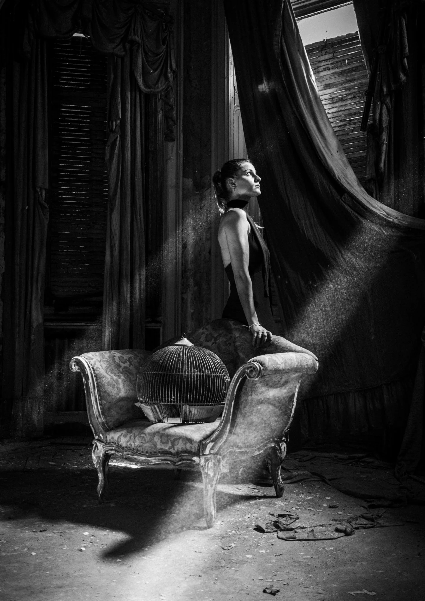 Portrait of a ghostly woman longing for her lost parrot. She is standing next to an old chair, with a bird cage on it, in an empty abandoned mansion from the last 1800s.