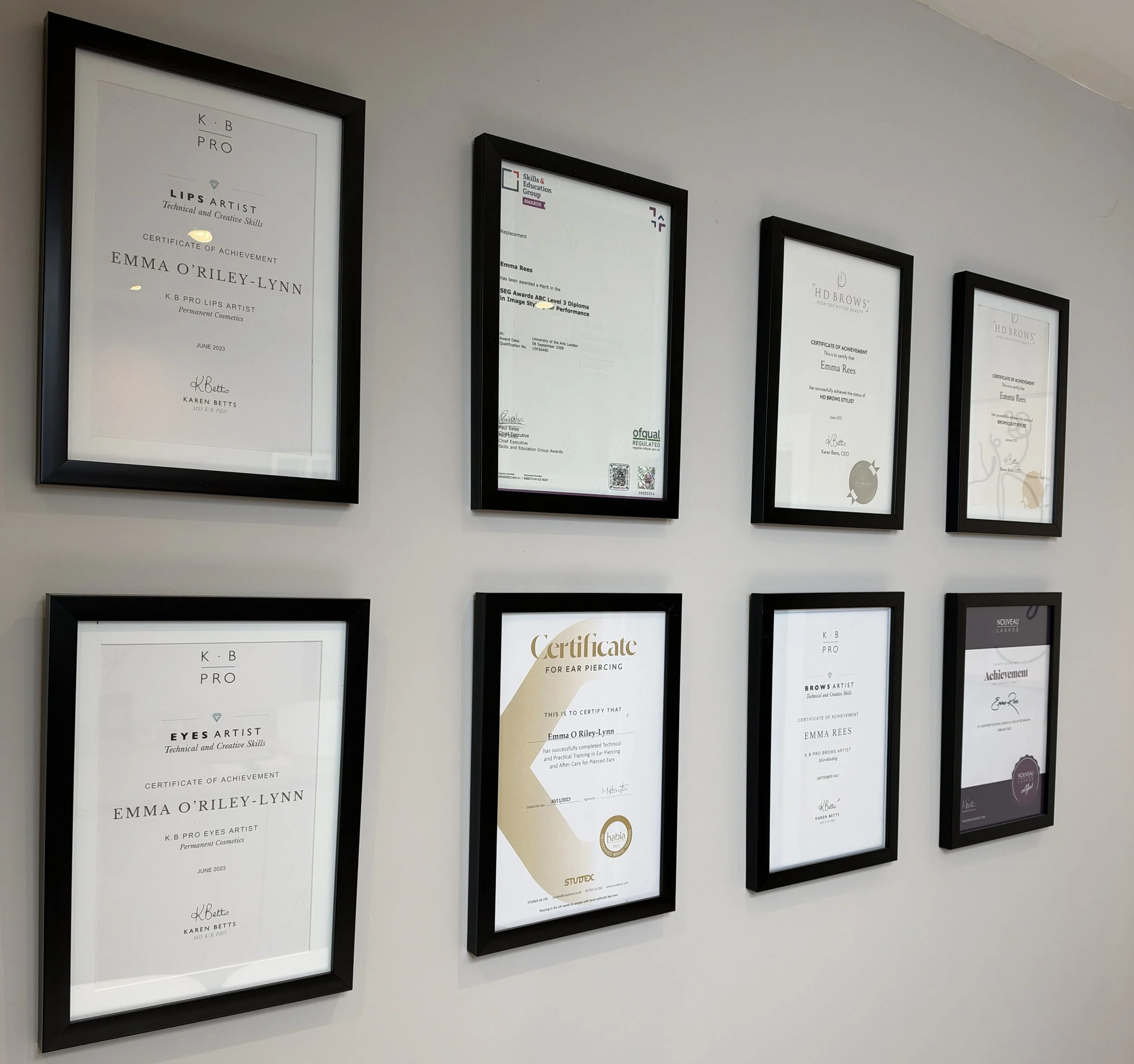 Emma Louise's framed KB Pro, Nouveau Lashes and HD Brows training certificates at her studio in Long Ditton, Surbiton