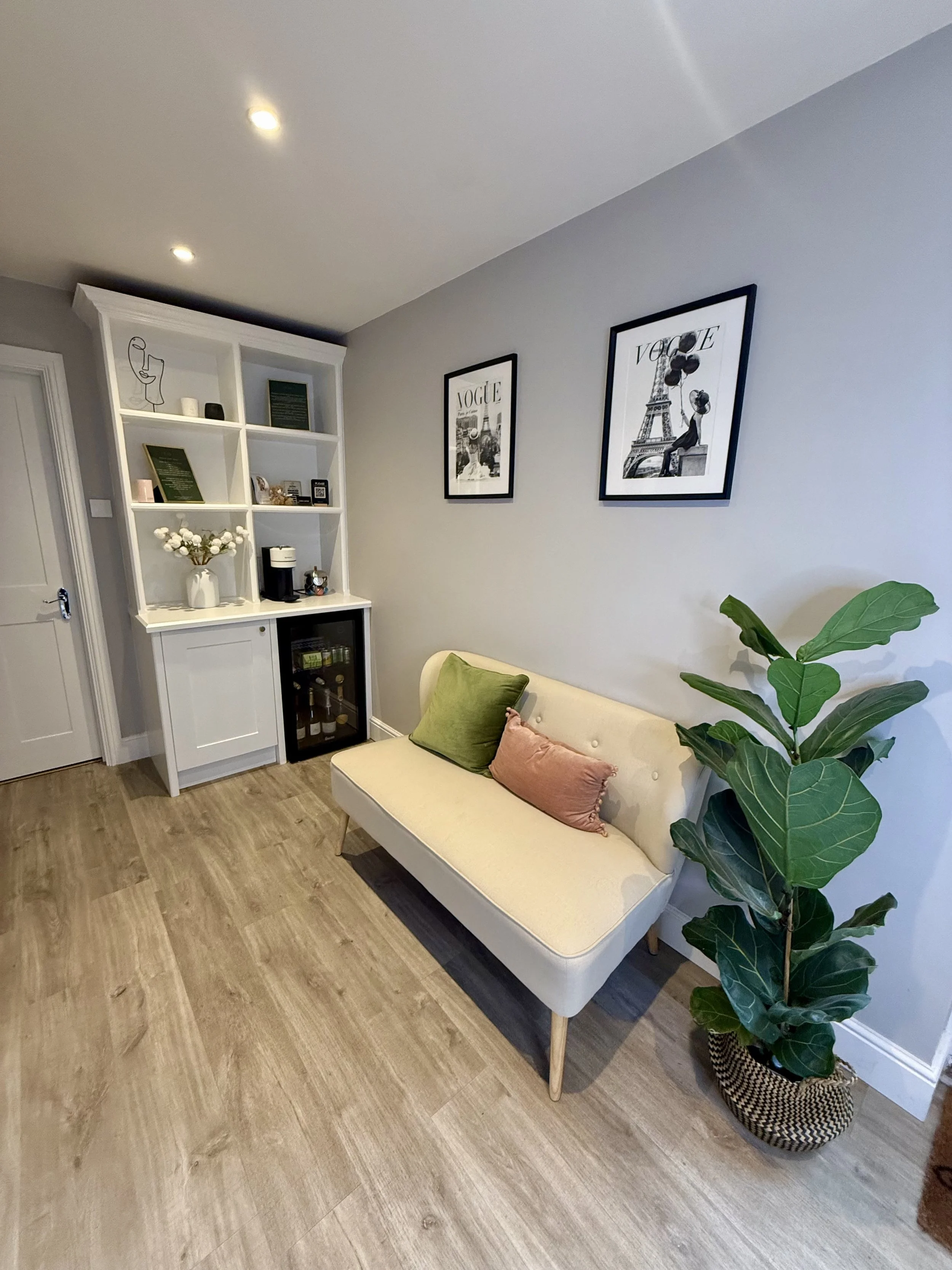 Relaxing waiting area with sofa at Enhanced by Emma Louise private studio, Surbiton
