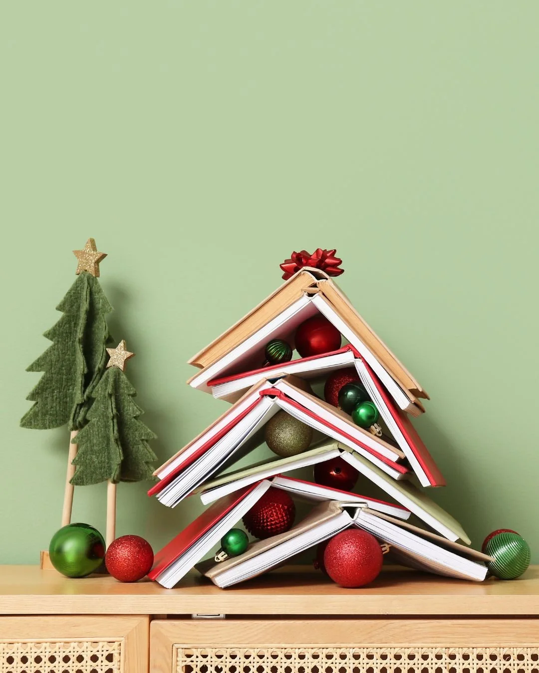 Books piled up like a Christmas tree