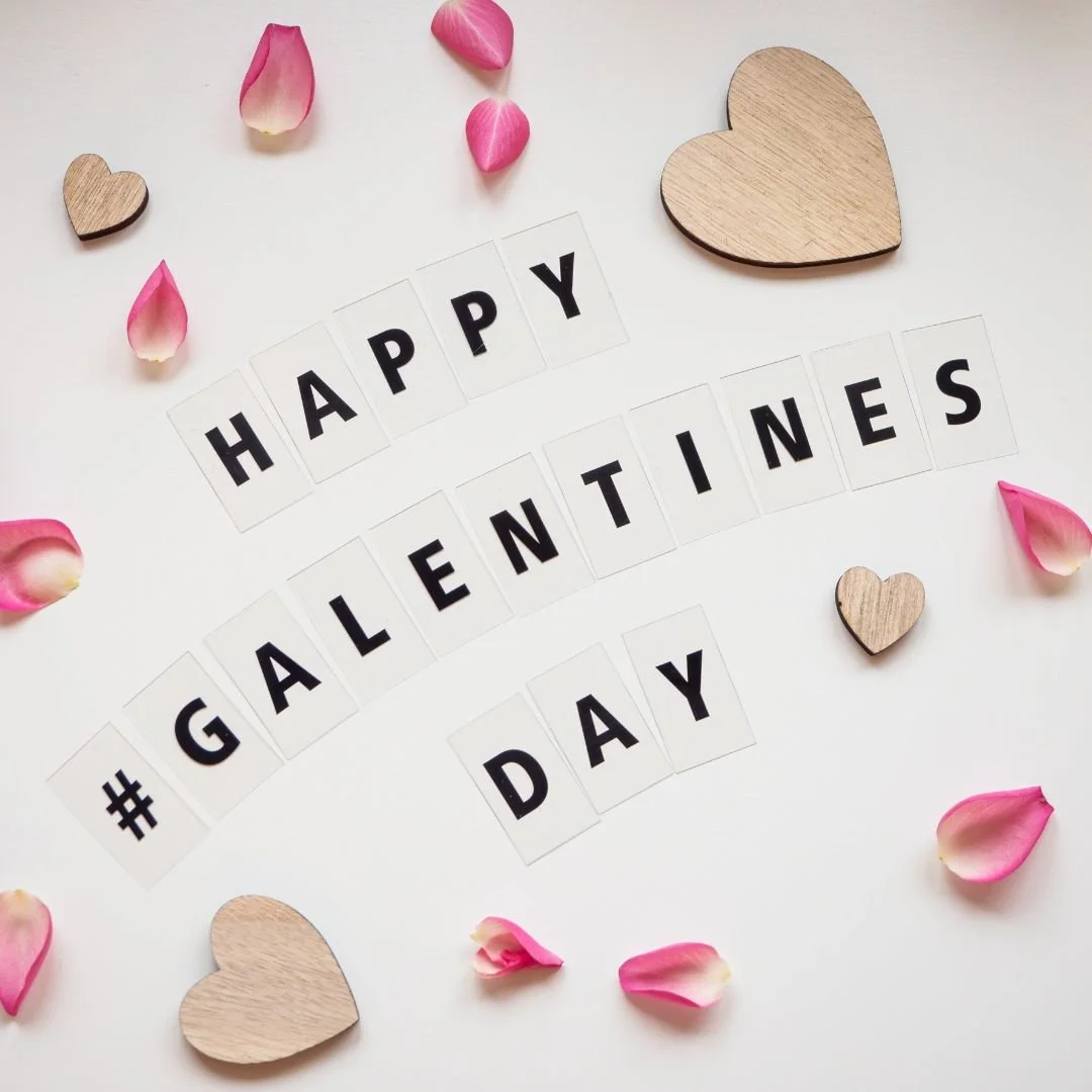 Happy Galentine's Day sign with hearts and petals