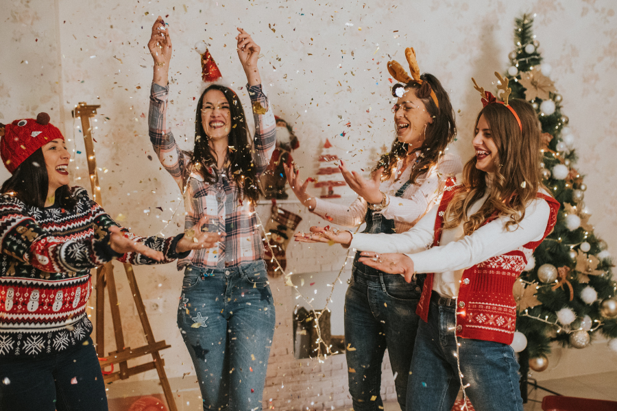 Four friends celebrating Christmas at a girls night