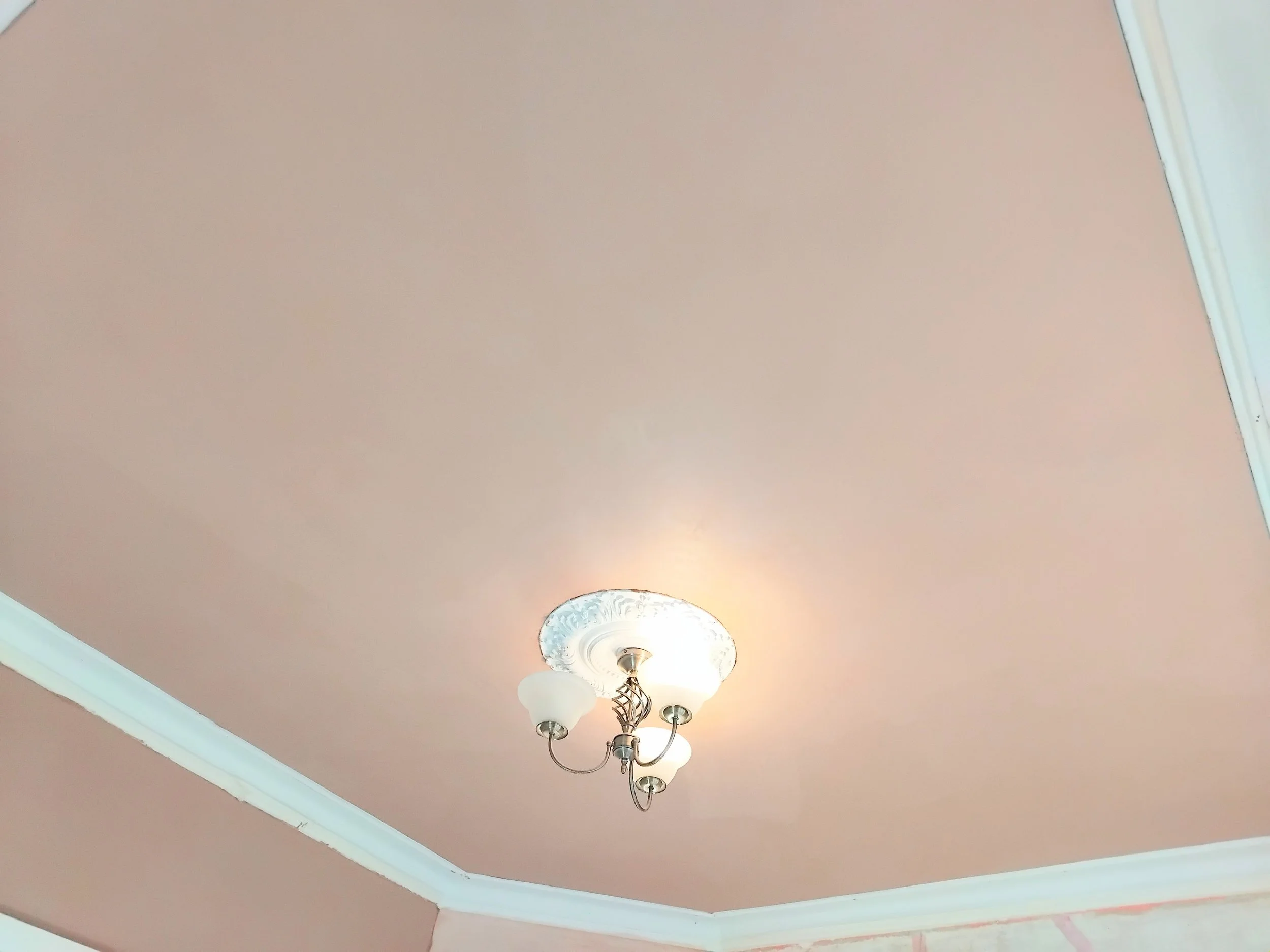 Living room ceiling plastered in Glossop