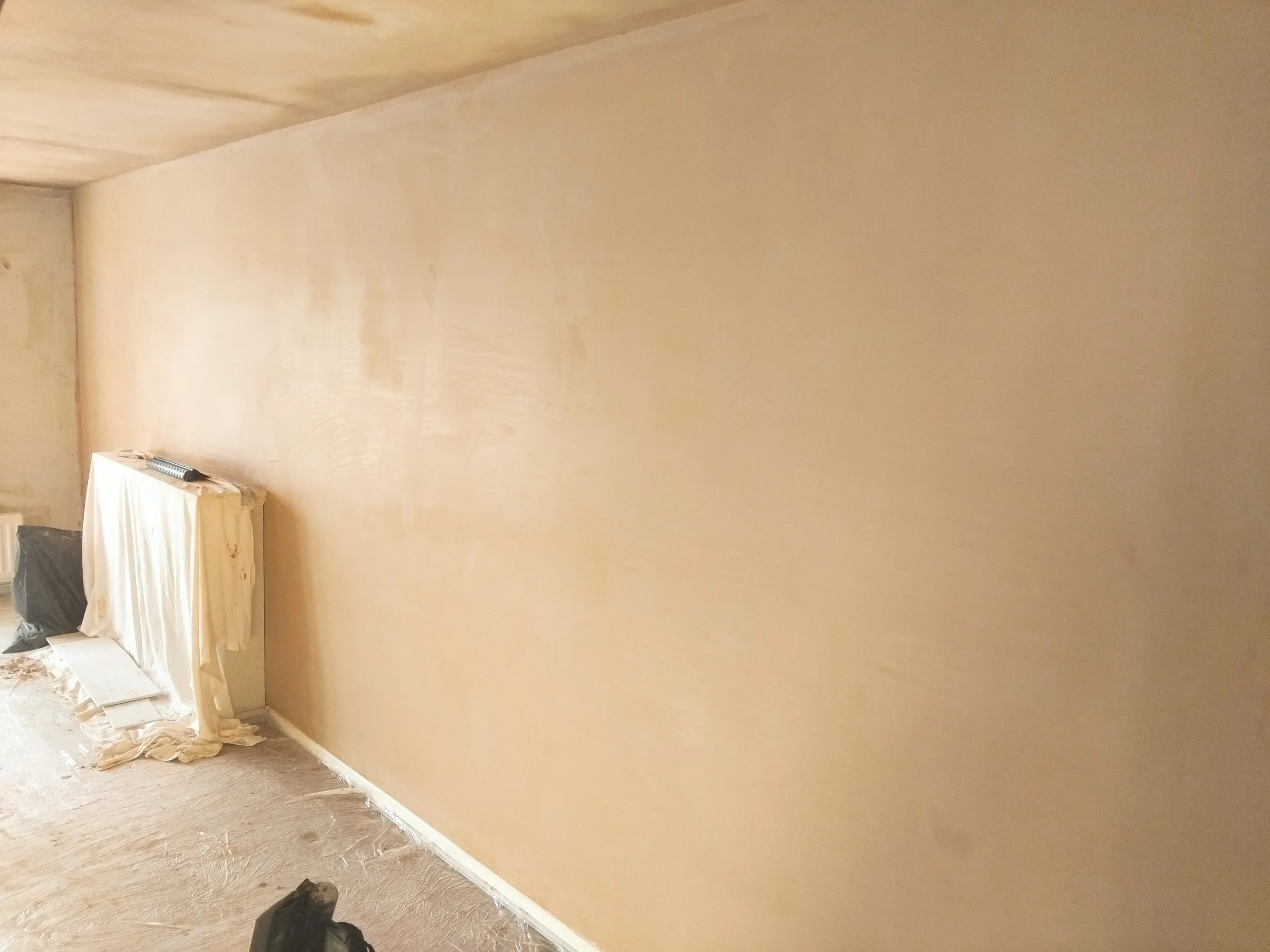 Living room repaired and skimmed in Mottram 