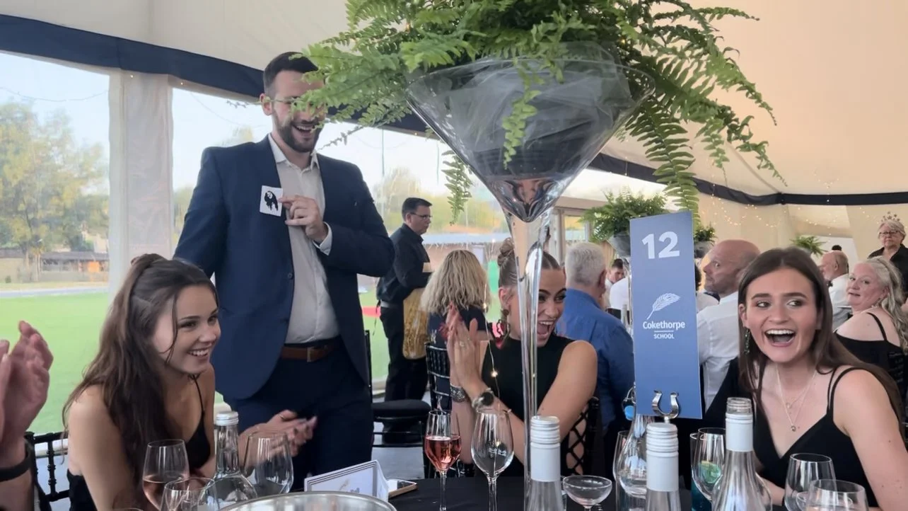Magician for corporate events Magician is performing magic at a corporate event