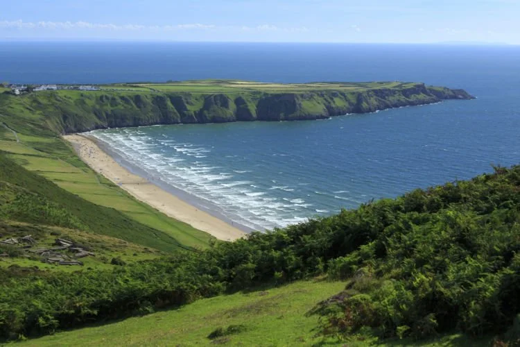 The Gower was the first place in Britain to be named an Area of Outstanding Natural Beauty. With cliffs and woodlands ringed by sparkling beaches, the Gower peninsula is so adored by walkers, birdwatchers, sunbathers and surfers, it’s been scooping a