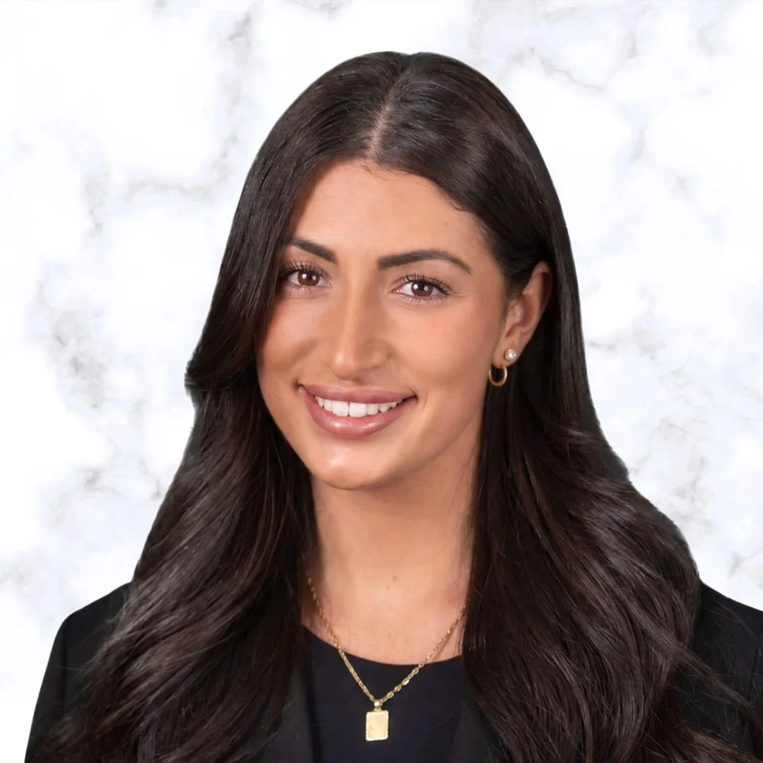 Nicole Rita, Registered Psychotherapist (Qualifying) at My Inner Peace Counselling & Psychotherapy in Newmarket, smiling warmly with long dark hair and wearing a black blazer.