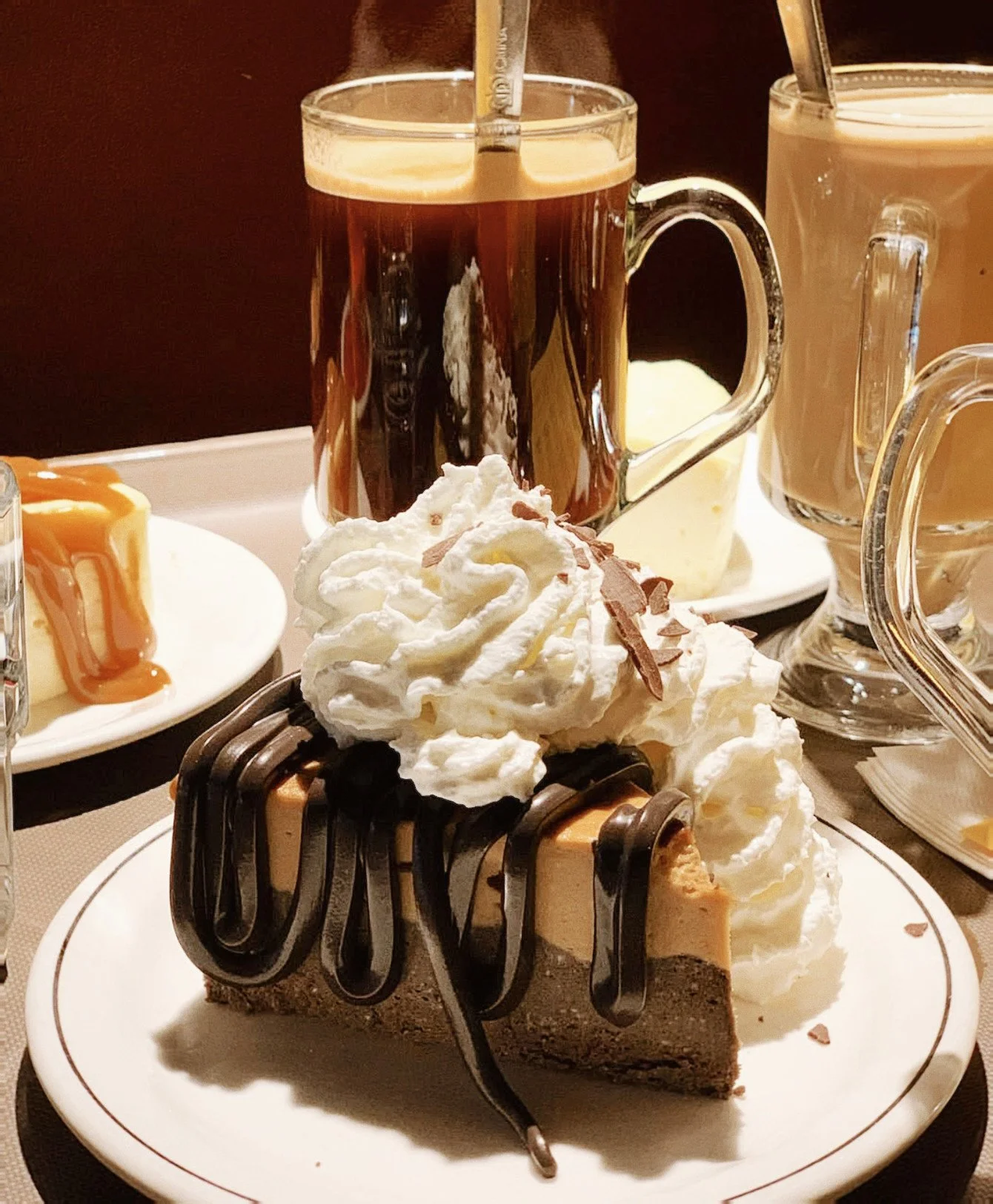 A South Granville institution since 1979. 🎷🍰✨⁠
⁠
Dim lighting, live jazz softly playing, and a slice of airy, souffl&eacute;-style cheesecake topped with fresh whipped cream - @cheesecake_etc has been Vancouver's favourite late-night sanctuary for 