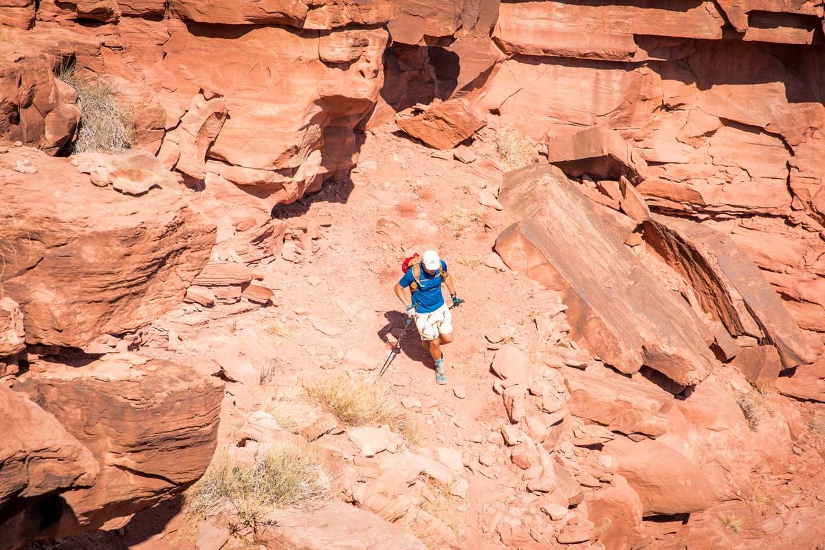  Male runner descending Jackson’s Ladder in Utah 