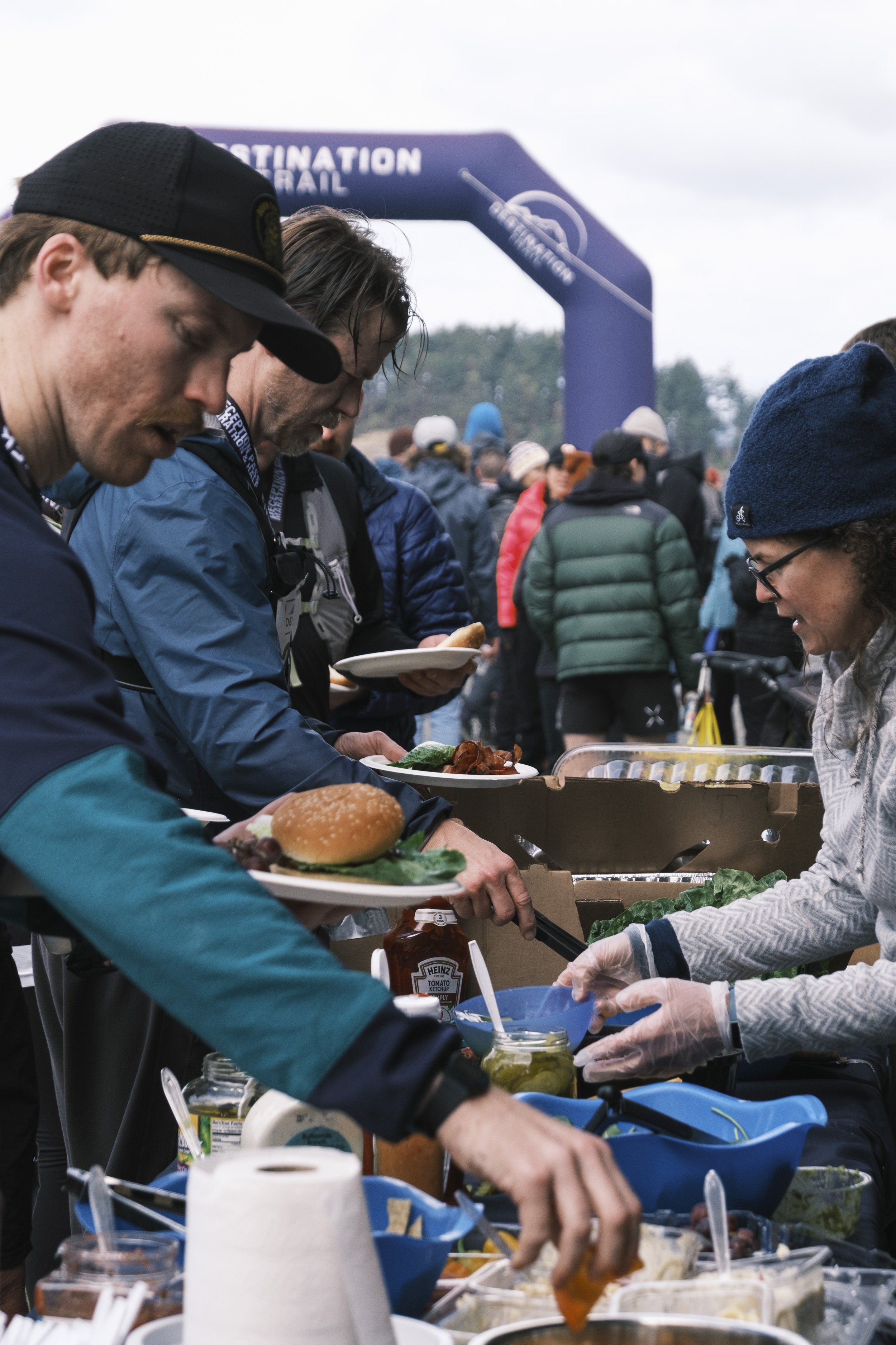Runners eating from a buffet after a race