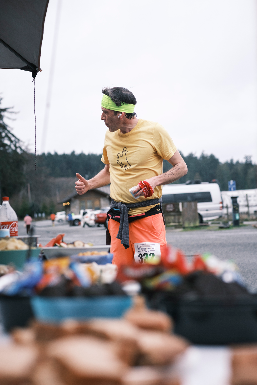  A male runner stops at the aid station for snacks 