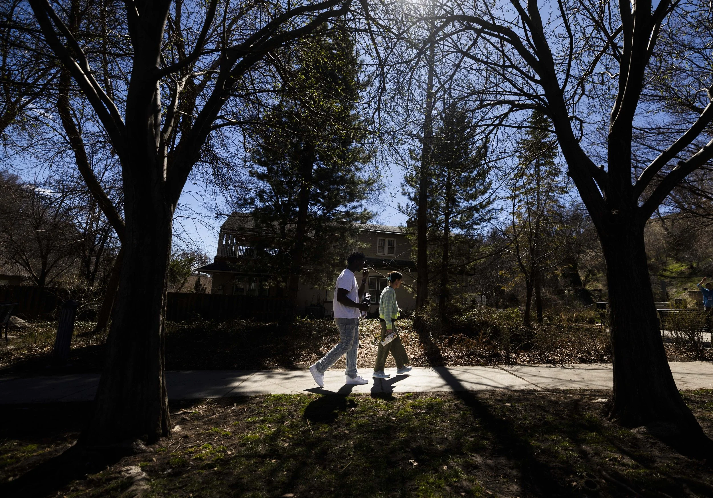 Caezar E. Warren walks and talks about his struggles with Channae Haller during a hike in Memory Grove Park on March 24, 2025.