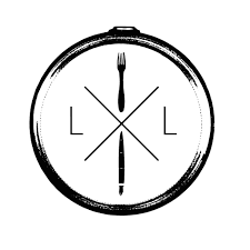 A clock with a fork at the 12 o'clock position and a knife at the 6 o'clock position, with two letters L on the sides.