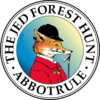 Logo of The Dead Forest Hunt Abbotruel featuring a fox wearing a red jacket and a hat, with green and gold colors in the background.