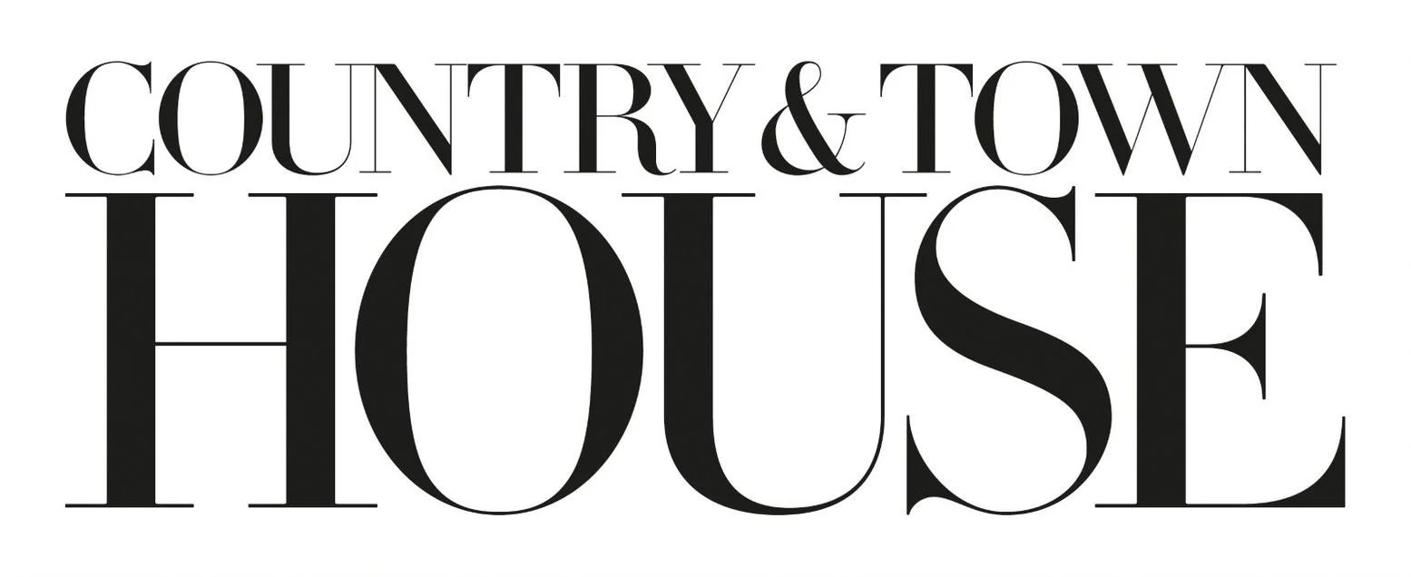 Text graphic that reads "Country & Town House" in large, stylish black and white font.