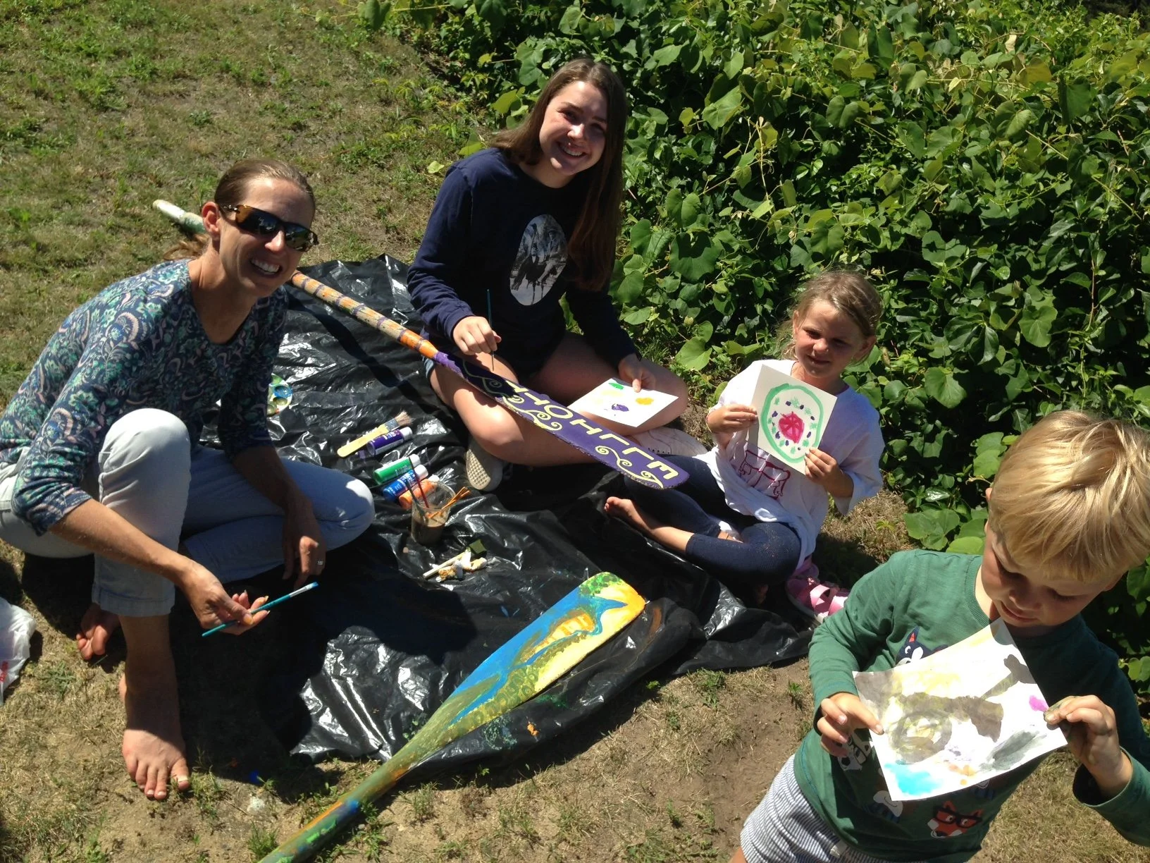Young painters on grass