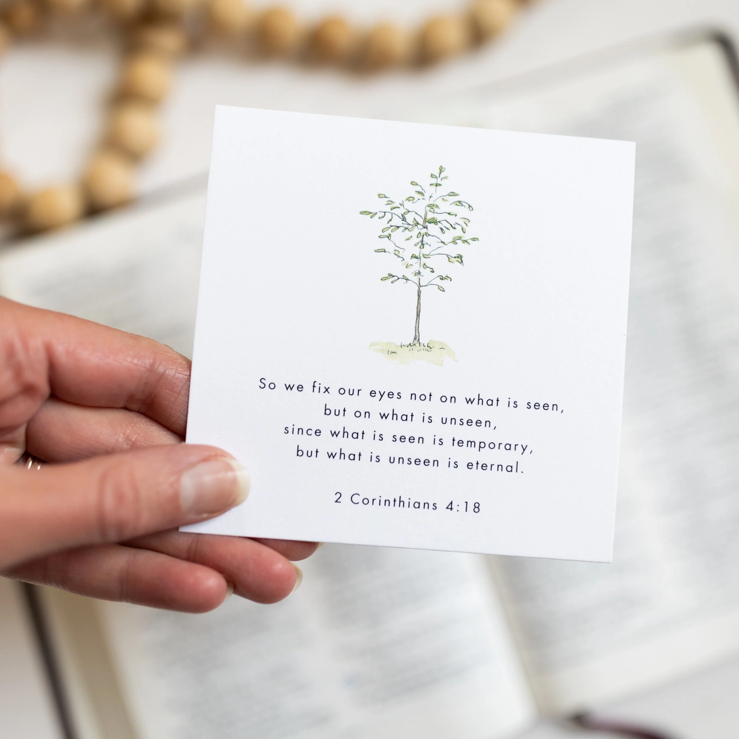 single card in front of bible.jpg