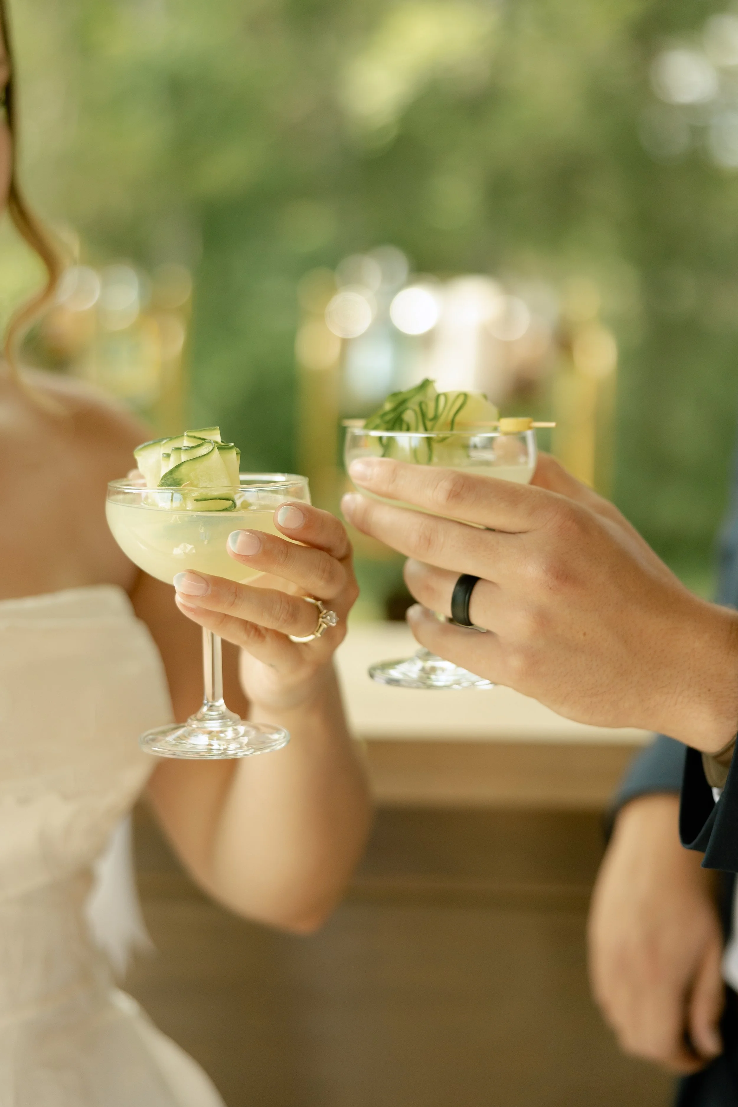 Couple toasting with custom cucumber signature cocktails created by French Honey Hospitality, providing wedding and event bar services in Virginia.