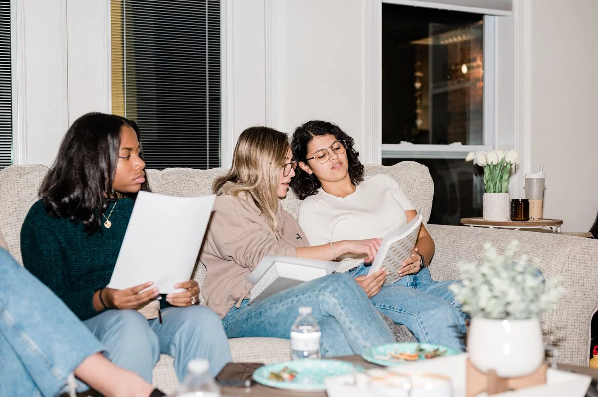 A group of women studying the bible together at connect group.