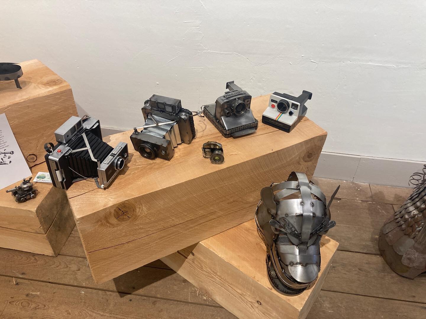 Real vintage Polaroid cameras and their steel scrap art facsimiles. #scrapart #metalart #cameraart #polaroid