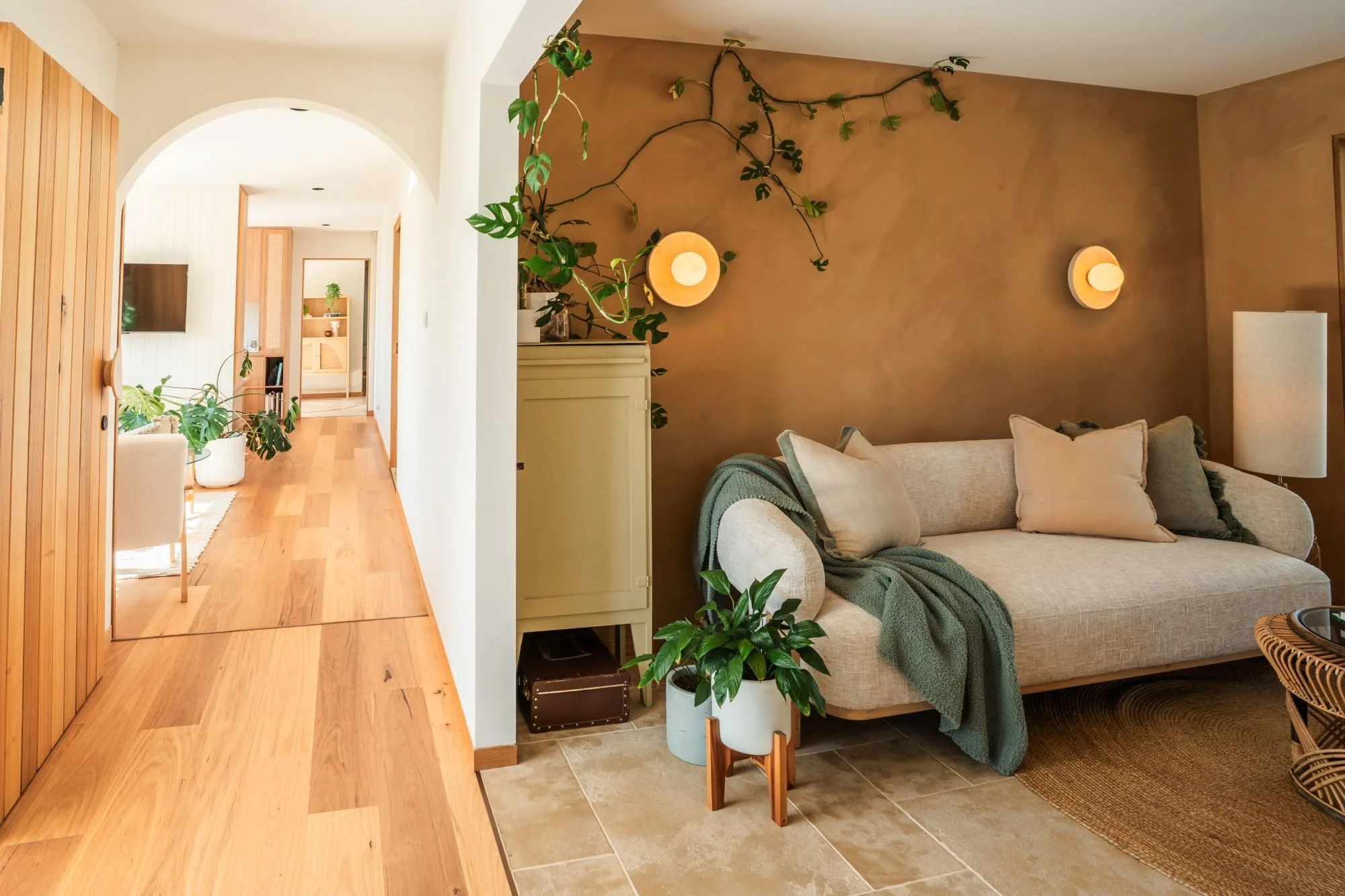 Arched hallway and textured plaster walls within the Raeburn interior.