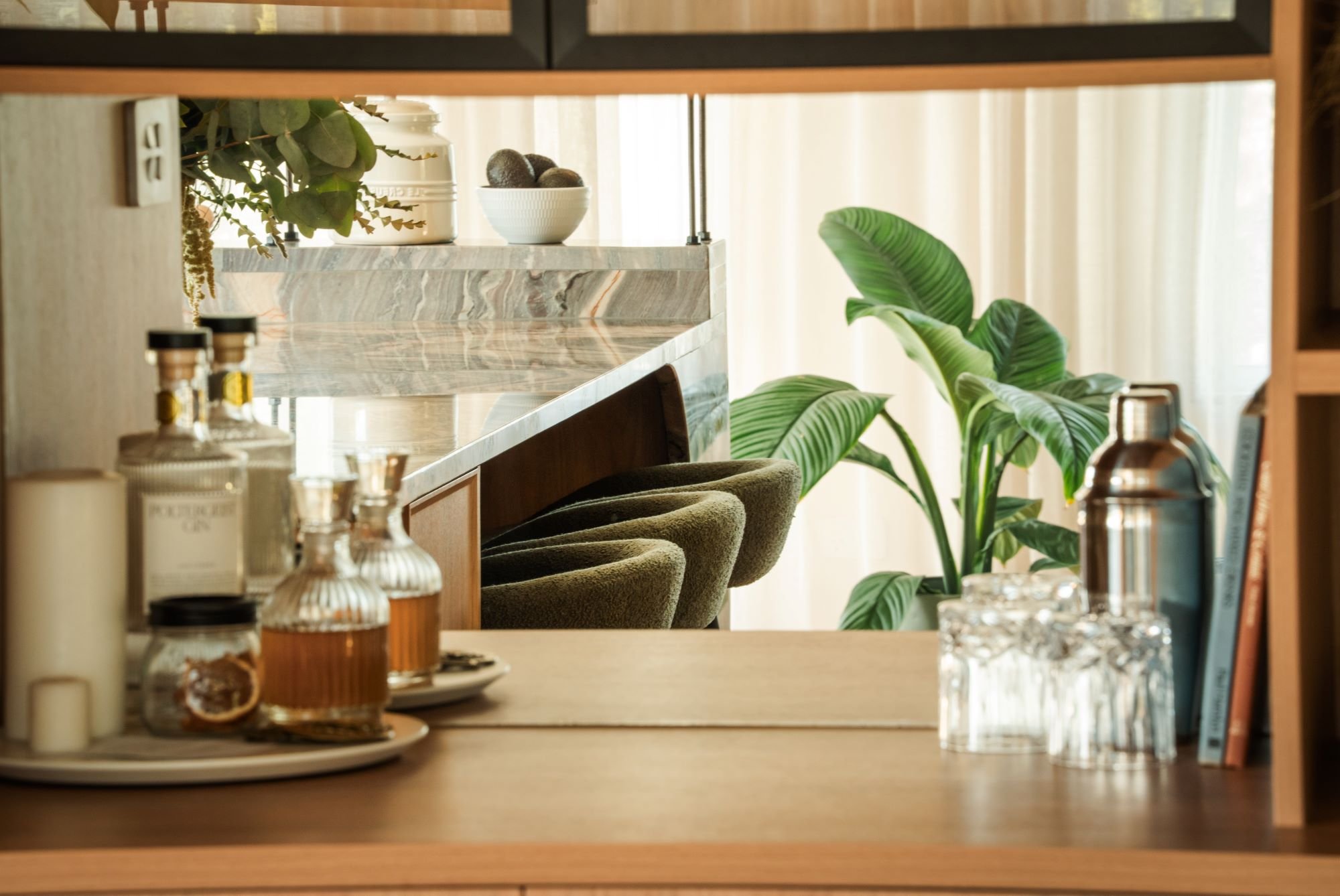 Detail of bar, stone benchtop and seating within the Raeburn kitchen.