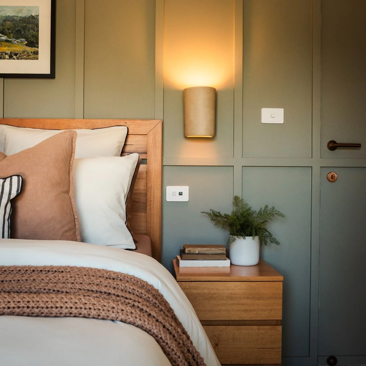 Bedroom wall detail at Raeburn showing integrated lighting and joinery details.