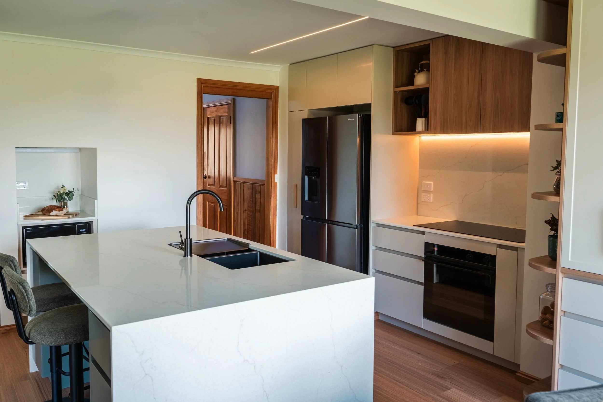 View of the kitchen, island seating and fresh baked sourdough
