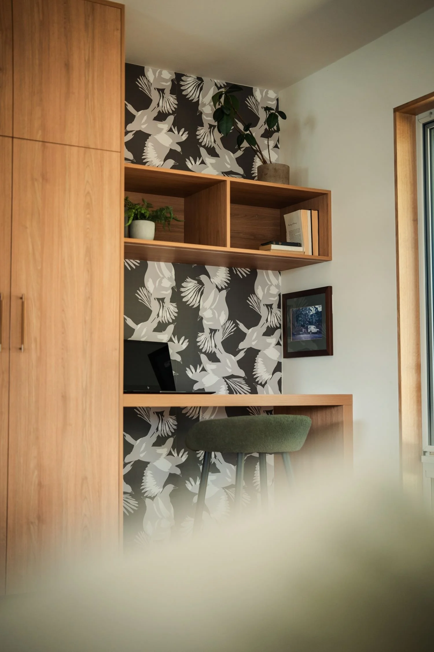 Study nook at Raeburn with custom joinery and patterned wallpaper.