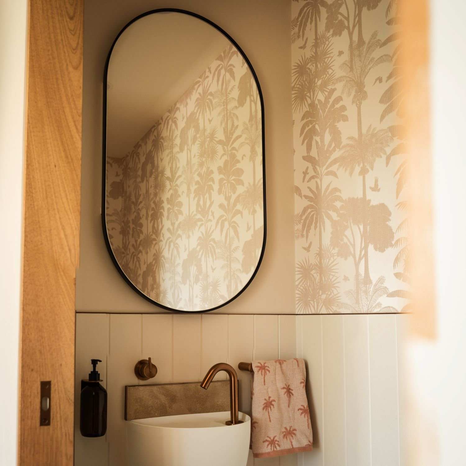 Powder room at Raeburn featuring wallpaper, VJ lining and mirror cabinet storage