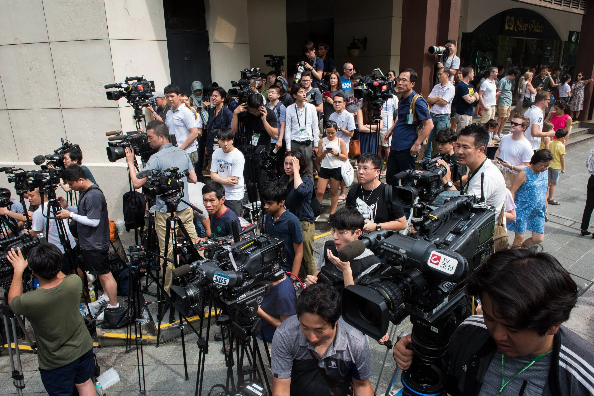 The shared space for journalists outside the vicinity of St. Regis hotel situated about 60-80 meters away from the designated drop off point for North Korean Kim Jong-un's arrival on 10 June, 2018.