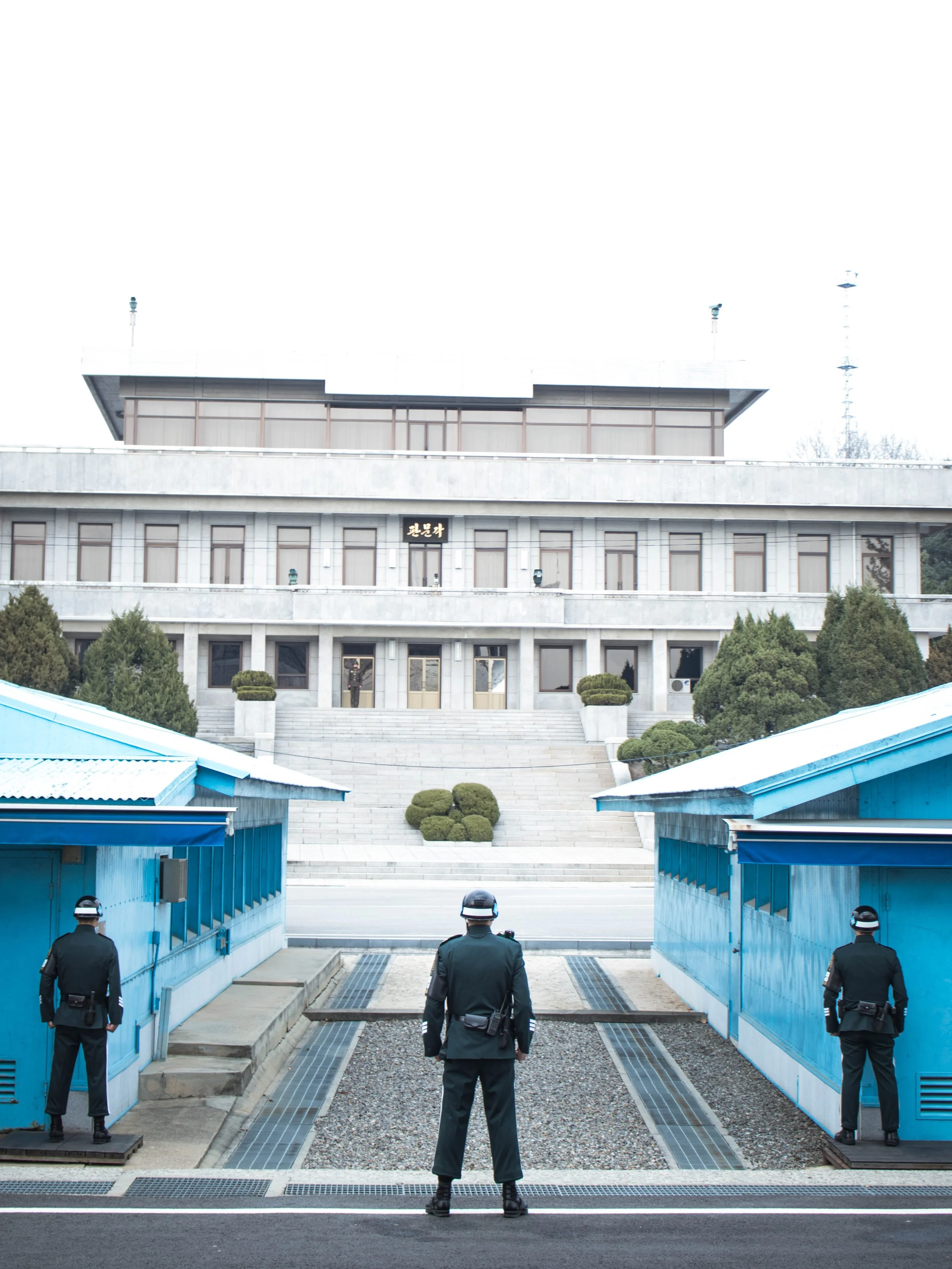 Opposing South and North Korean military personnels overlooking the demilitarized zone separating the two halves of Korea.