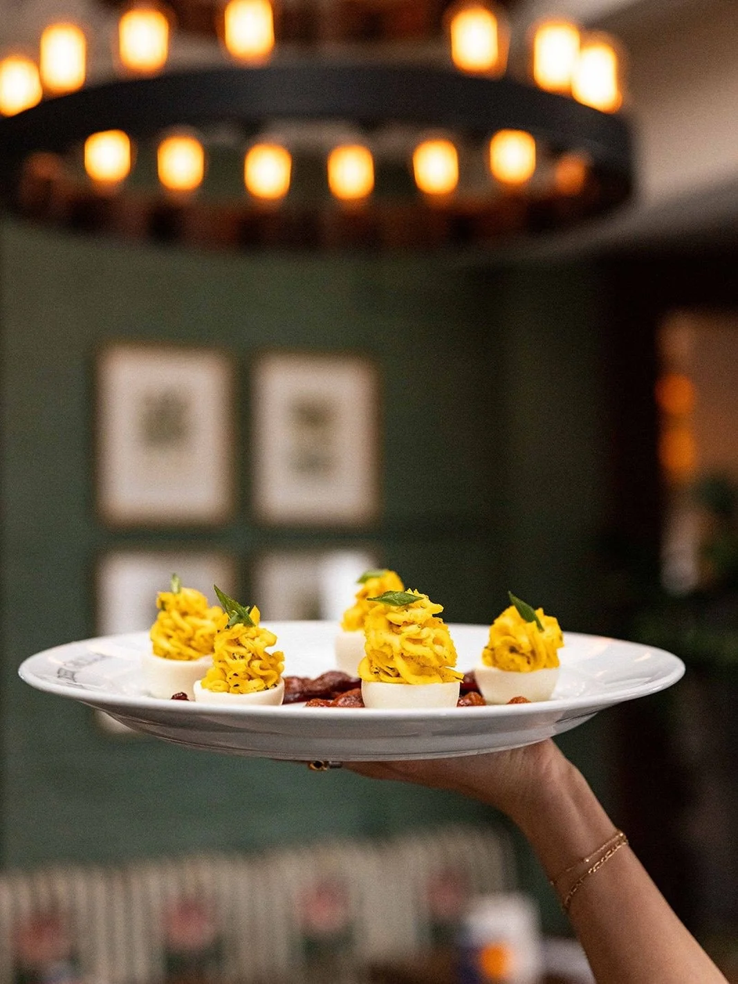 Charlotte&rsquo;s deviled eggs with applewood brown sugar smoked bacon.