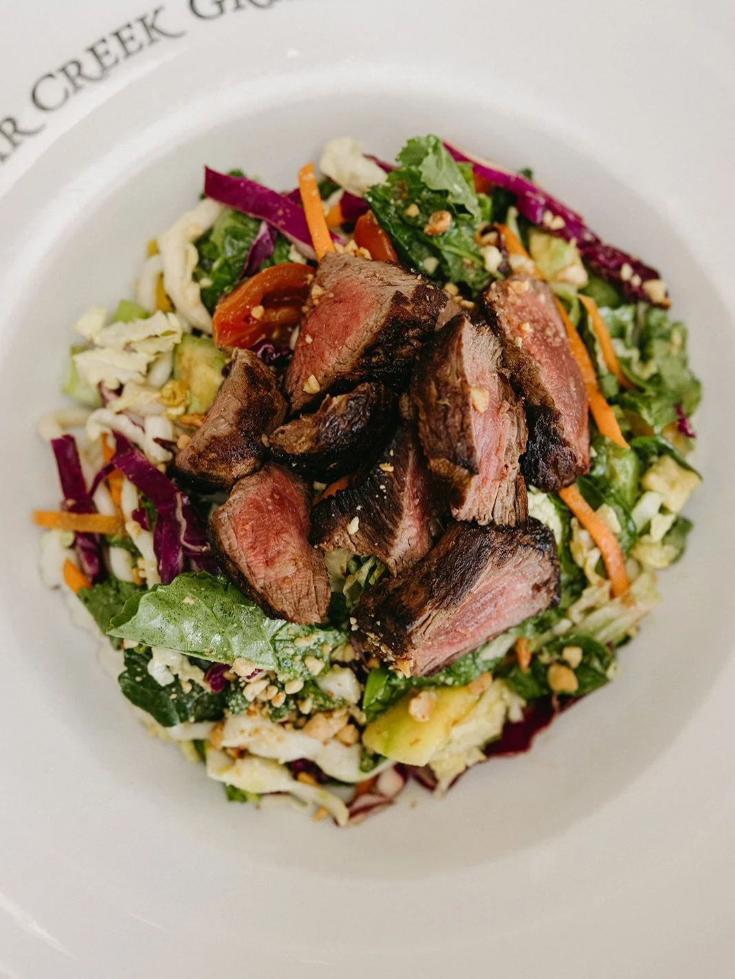 Thai Steak Noodle Salad⁠
marinated steak, mango, kale, tomato, avocado, peanuts, carrot, cilantro, mint, basil, thai vinaigrette