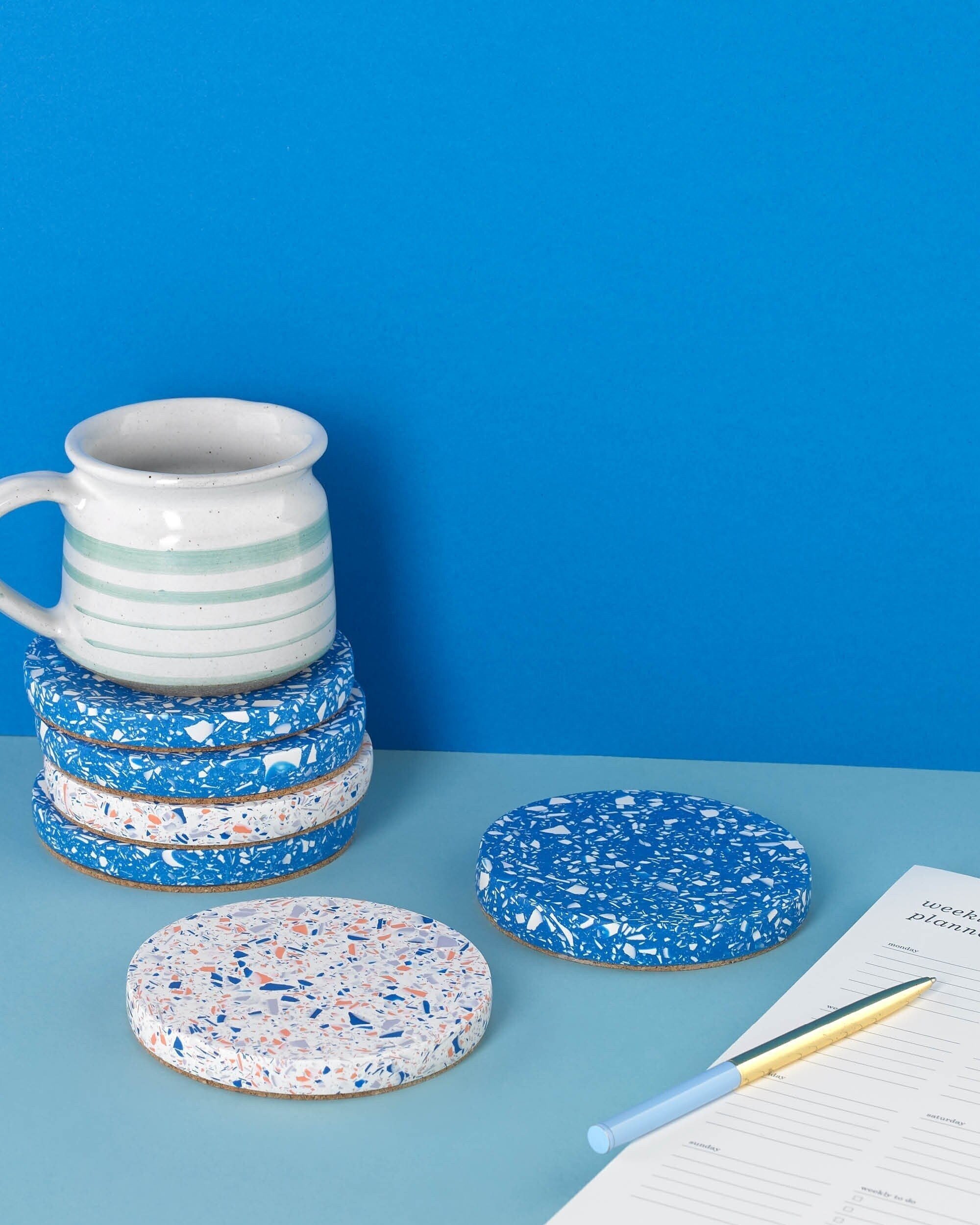 coffee cup on coasters, with a notepad and pen, terrazzo pattern (Copy)